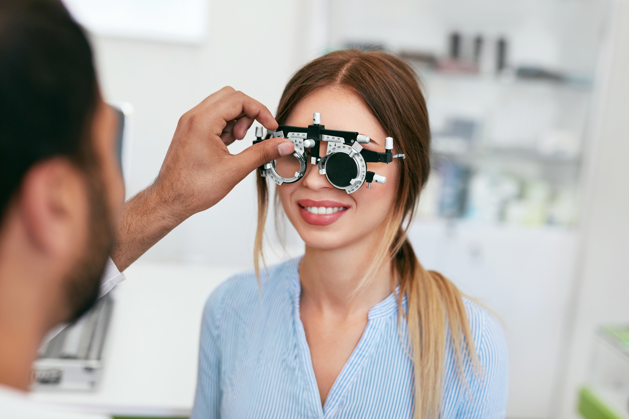 Optometry Test. Eye Doctor Checking Woman Eyesight At Clinic